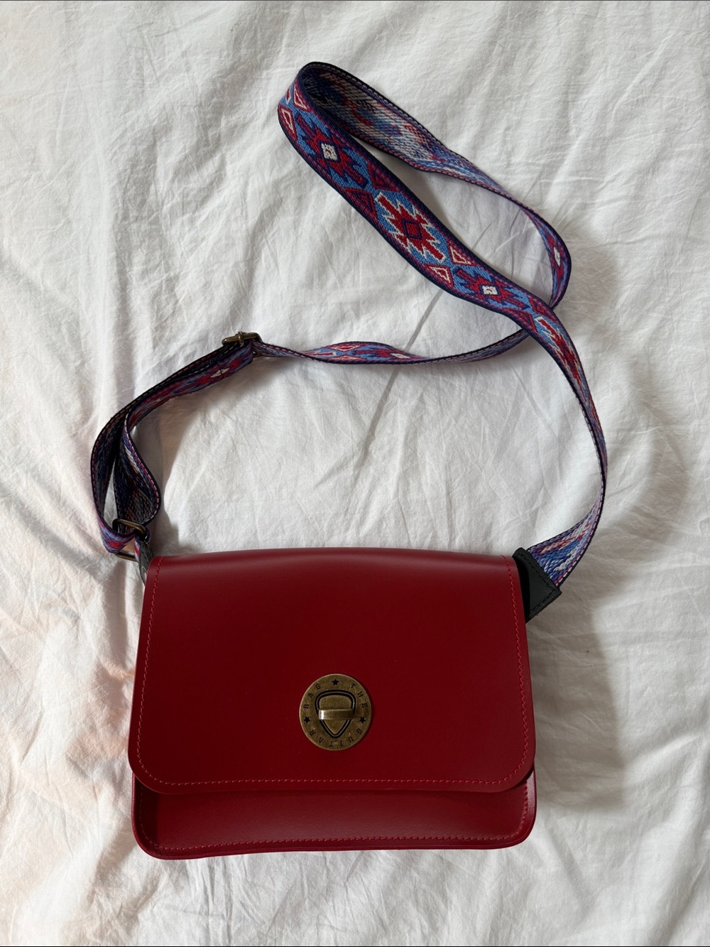 The Guitar Bag Red Leather Crossbody Bag with Decorative Strap